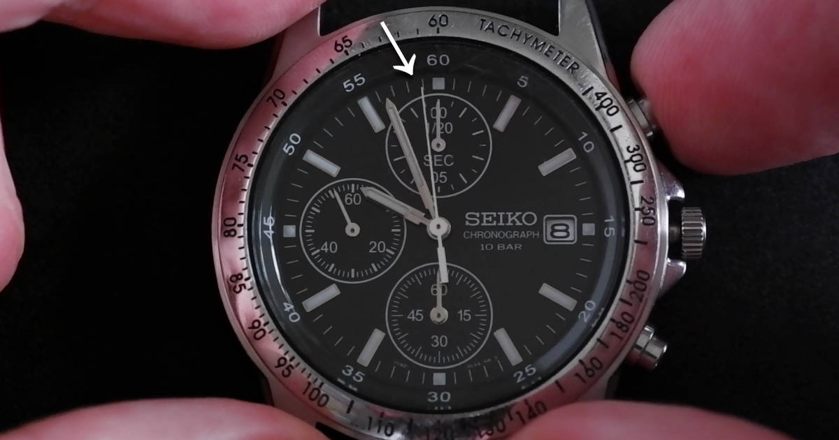 A Seiko 7T92 chronograph watch with a misaligned stopwatch hand.