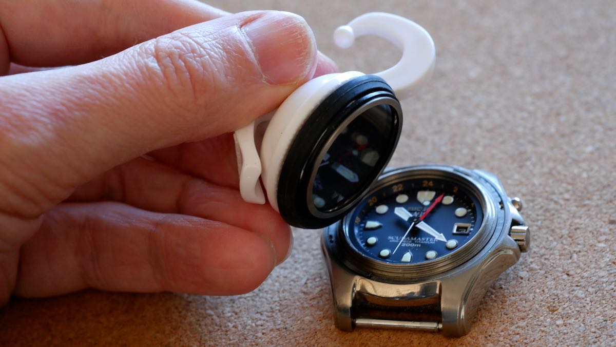 A suction cup pulling off a watch crystal.