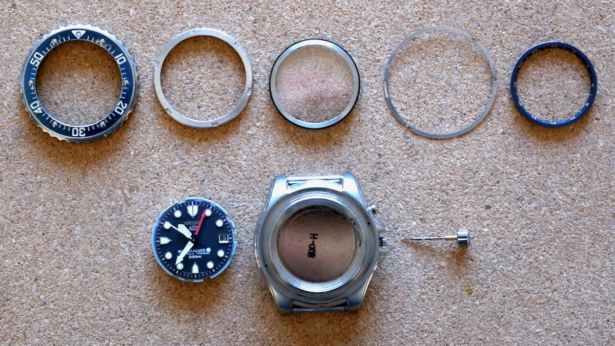 The disassembled parts of a Seiko 5M45-6A30 'Stingray' diver's watch.