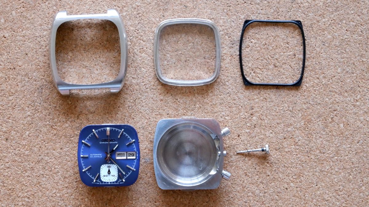 The disassembled parts of a Seiko 7018-5000