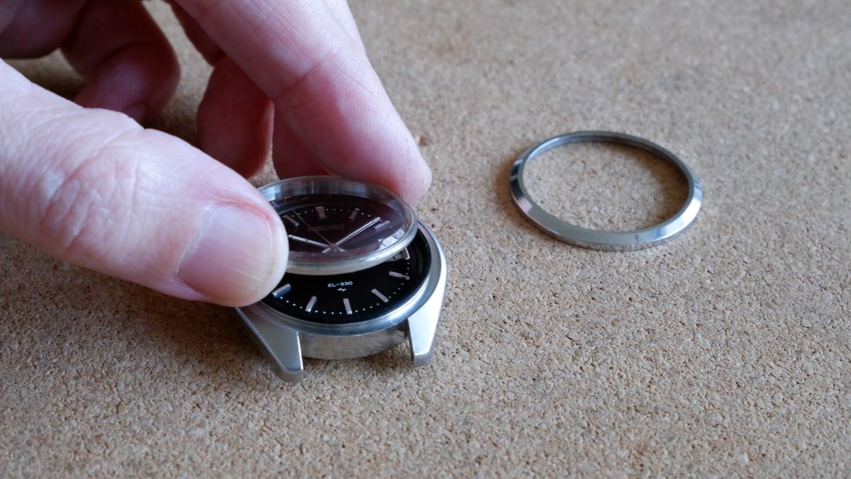 Lifting the crystal off a watch.