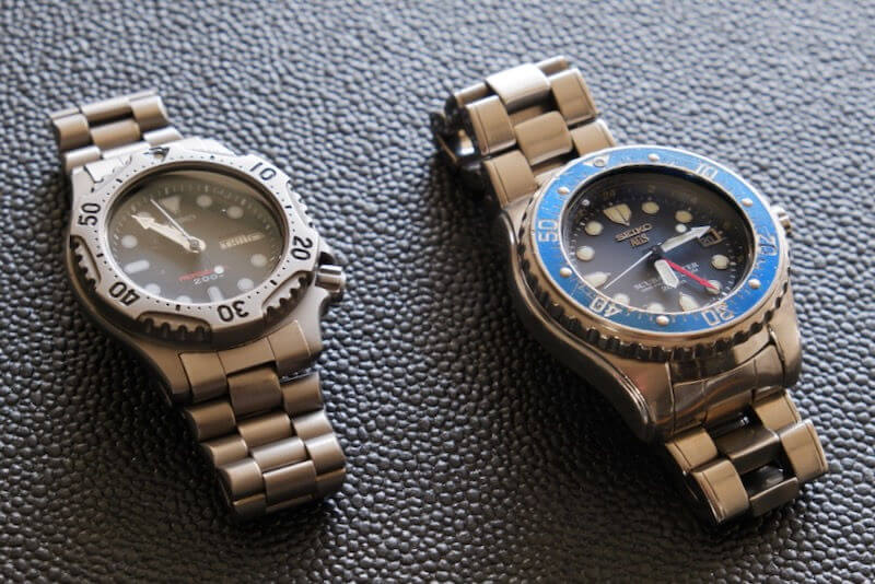 Two Seiko diving watches with titanium bracelets.